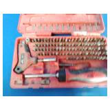 Mac Tools 123-Piece Master Bit Set (model SBDR123SA or similar), featuring a red plastic carrying case.