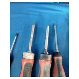 Mac Tools screwdrivers with red and black handles.