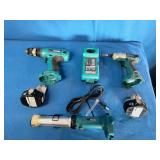 Makita 6337D 14.4V cordless tool set featuring teal-colored drills and a matching charger.
