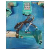 Makita 6337D 14.4V cordless tool set featuring teal-colored drills and a matching charger.