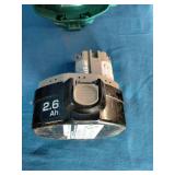 Makita 6337D 14.4V cordless tool set featuring teal-colored drills and a matching charger.