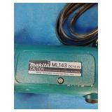Makita 6337D 14.4V cordless tool set featuring teal-colored drills and a matching charger.