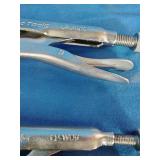 Mac Tools U-shaped locking welding clamps, designed for holding metal panels in place.