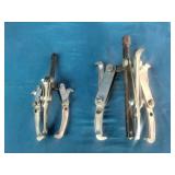 (2) 3-jaw gear pullers used for removing gears, pulleys, and pressed-on components.