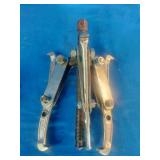 (2) 3-jaw gear pullers used for removing gears, pulleys, and pressed-on components.