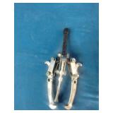 (2) 3-jaw gear pullers used for removing gears, pulleys, and pressed-on components.