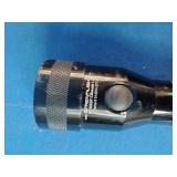 Two Maglite flashlights, two Motorola walkie-talkies, and one infrared thermometer