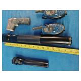 Two Maglite flashlights, two Motorola walkie-talkies, and one infrared thermometer