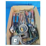 Variety of essential hand tools commonly used for household repairs, carpentry, and electrical work.