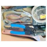 Variety of essential hand tools commonly used for household repairs, carpentry, and electrical work.