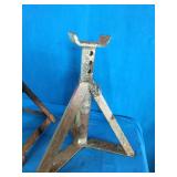 Adjustable jack stands. One says 5.5 Ton