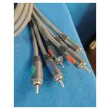 Bulk lot of various electronic accessories, including power adapters, charging cables, and audio/video cables.