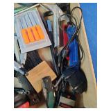 This box contains a variety of miscellaneous hand tools and hardware