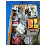 Assortment of fasteners, hardware, and workshop supplies.