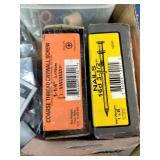 Assortment of fasteners, hardware, and workshop supplies.