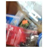 Assortment of fasteners, hardware, and workshop supplies.