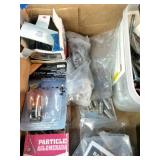 Assortment of fasteners, hardware, and workshop supplies.