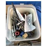 Assortment of fasteners, hardware, and workshop supplies.