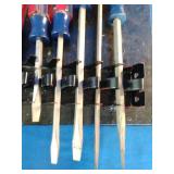 Craftsman acetate-handle screwdrivers mounted on a storage rack organizer.