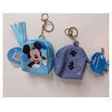 NIB CandyRific Disney Mini Backpacks featuring characters like Mickey Mouse and Stitch on a small, zippered pouch
