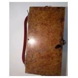 1950s box purse features a tortoiseshell-style lucite lid and intricate filigree brass sides