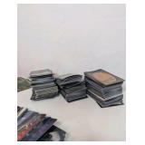 Unsorted Magic: The Gathering cards, including various decks, stacks of sorted cards, and tokens or counters