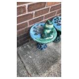 Two decorative outdoor tables with tree design and frog statue