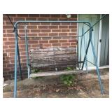 Outdoor swing with wooden bars and metal