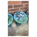 Two decorative outdoor tables with tree design and frog statue