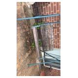 Outdoor swing with wooden bars and metal