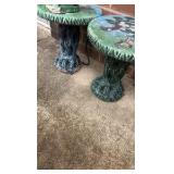 Two decorative outdoor tables with tree design and frog statue