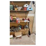 Contents of wooden shelves, including:- various paints- gloss trim- Wheaties box- board games- decorative outdoor lighting- tools- vacuum- mini shop back