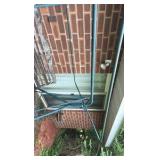 Outdoor swing with wooden bars and metal