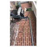 Outdoor swing with wooden bars and metal