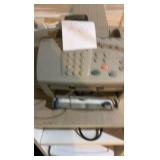 Two storage copies, one with wheel disassembled and fax/printer machine and stand on wheels