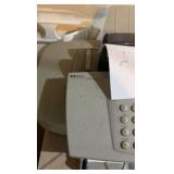 Two storage copies, one with wheel disassembled and fax/printer machine and stand on wheels