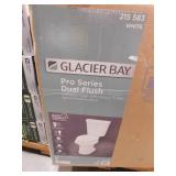 Glacier Bay 12 in. Rough In 2-Piece 1.0 GPF/1.28 GPF Dual Flush Elongated Toilet in White, Seat Included