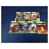 5 Xbox 360 games in cases and 2 empty cases