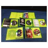 5 Xbox 360 games in cases and 2 empty cases
