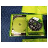5 Xbox 360 games in cases and 2 empty cases