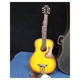 Vintage Harmony Stella guitar with case and extra strings