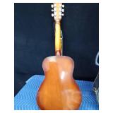 Vintage Harmony Stella guitar with case and extra strings