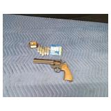 Vintage Crossman Model 357 CO2-powered pellet revolver with CO2 cartridges and pellets