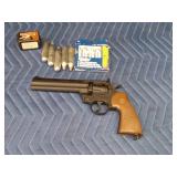 Vintage Crossman Model 357 CO2-powered pellet revolver with CO2 cartridges and pellets