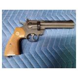 Vintage Crossman Model 357 CO2-powered pellet revolver with CO2 cartridges and pellets