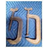 3 large metal clamps and a clevis hitch