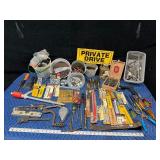 Tote of new and used hardware and tools