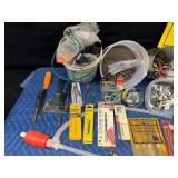 Tote of new and used hardware and tools