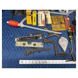 Tote of new and used hardware and tools