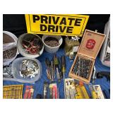 Tote of new and used hardware and tools